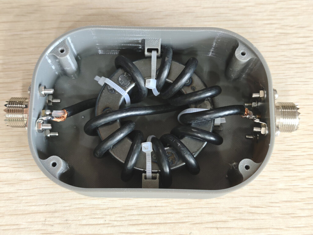 11 turns RG58 coax wound on FT-240-43 ferrite core choke balun