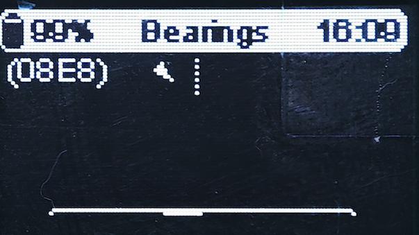 Meshtastic node OLED bearing screen with node ID and direction indicator