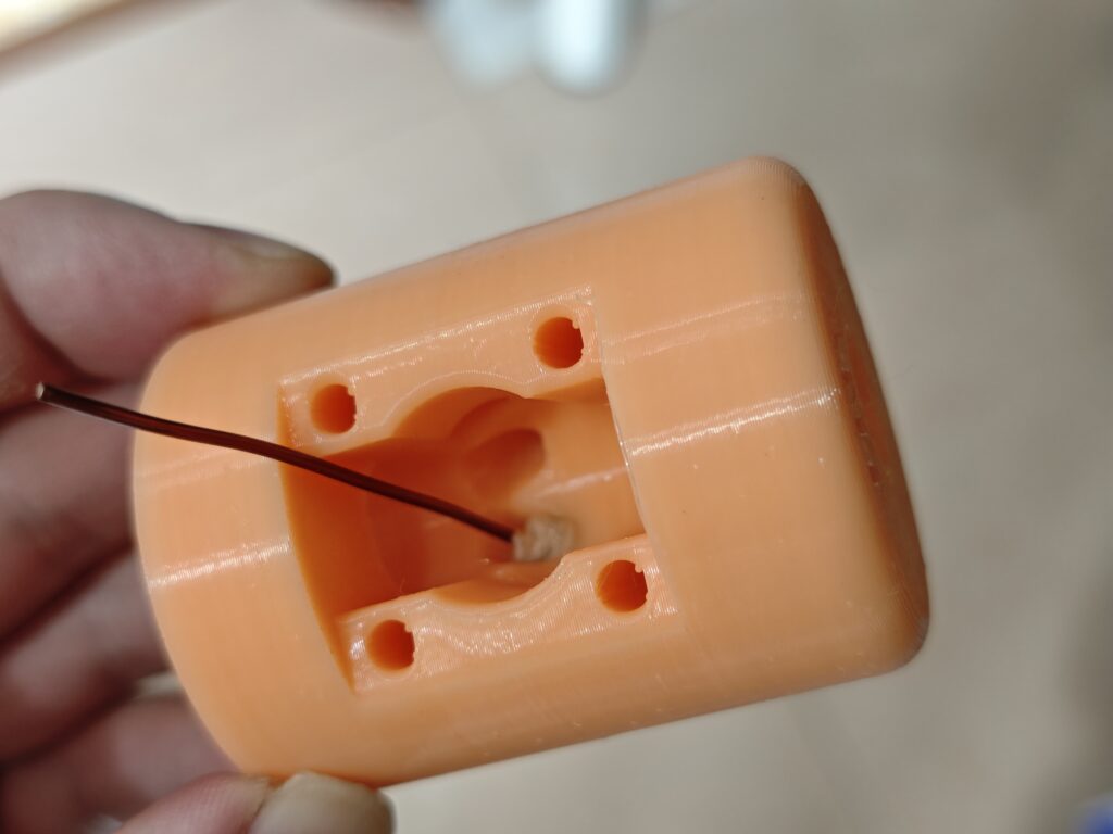 the antenna base, implanted banana jack with a short piece of enamel wire, front view