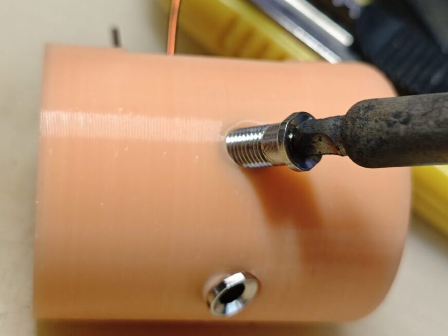 the antenna base, use a solder iron to heat the banana jack and push it into the 3d printed antenna base