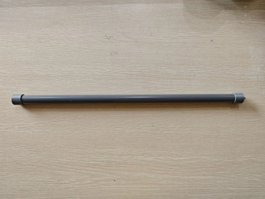 Finished homemade J-Pole antenna enclosed in gray PVC pipe for waterproofing